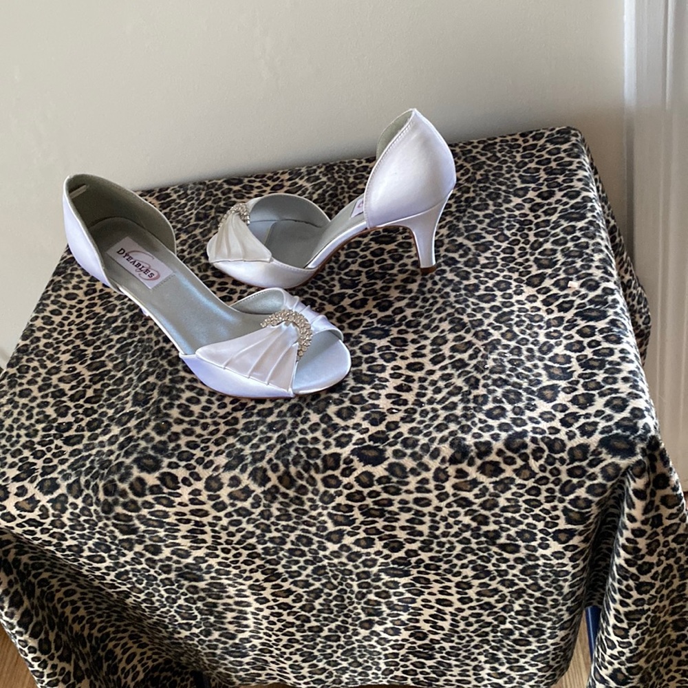 White satin peep toe pump size 6 1/2. New heel is 2 1/2 inches